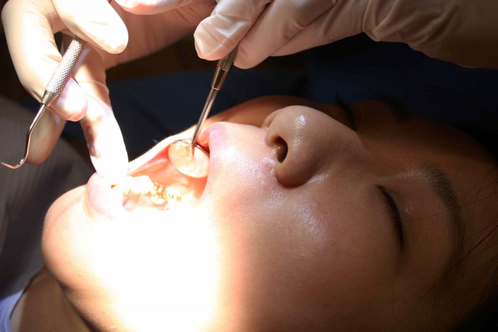 patient having teeth examined